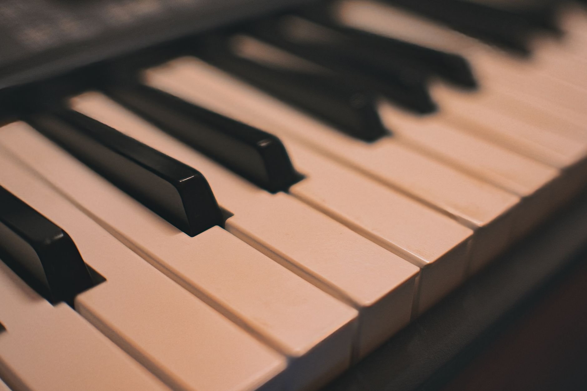 Elegant close-up of piano keys with warm lighting